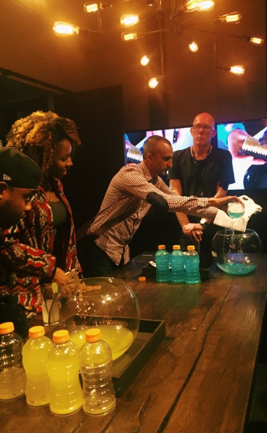Riz showing Alvin Akintimehin Thater Mag and Ann Akineuoyn Playbook Agency how the product works on a shirt 540x876 - Event Recap: Crep Protect's U.S. Launch @crepprotect @NeueHouse #CrepProtect